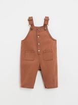 Long dungarees in rust-coloured twill offre à 45,5€ sur Natalys