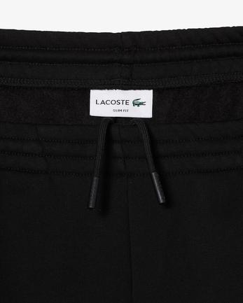 Pantalon de survêtement Jogger slim fit homme en molleton de coton biologique offre à 120€ sur Lacoste
